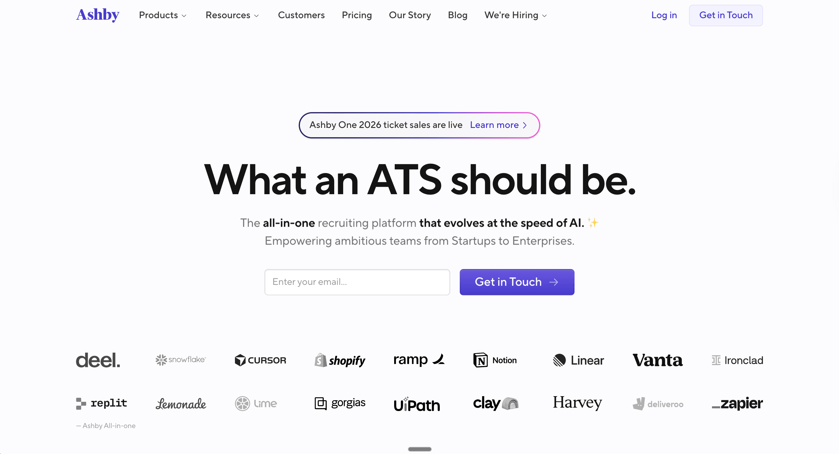 Screenshot of Ashby’s website homepage showing the headline “What an ATS should be,” describing an all-in-one recruiting platform that evolves with AI, with a call-to-action to get in touch and logos of well-known startup and enterprise customers displayed below.